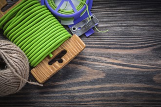 Garden soft twist tie hank of rope on wooden board gardening concept