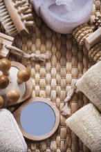 Composition of refreshment skincare items on wicker background sauna concept