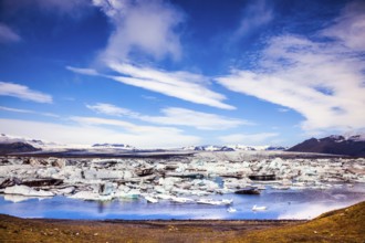 Sunrise in the Ice Lagoon. Drift ice Ice Lagoon - Jokulsarlon. Ice floes are reflected in the