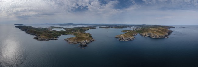 A wide panorama landscape of the islands and coastline of Baltimore Harbor in West Cork County in