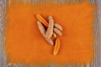 Turmeric root and curcuma spice background. Anti-inflammatory herbal medicine, nutrional supplement