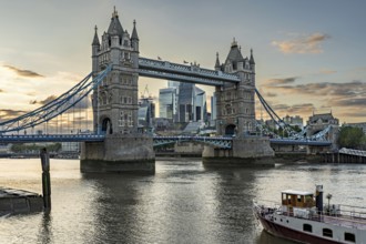 View over the Thames with Tower Bridge and the skyline in the evening light, London, England, Great