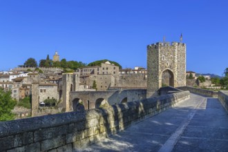 12th-century Romanesque bridge over the Fluvia river in Besalu, Spain, Europe