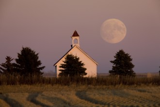 Old Country Church in Saskatchewan full harvest moon