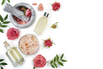 Flat design of rose cosmetics concept of mortar and pestle with rose buds with dropper salt and oil