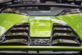 WETZLAR, Germany 2022-04-23: Lamborgini metallic logo closeup on Lamborghini car displayed