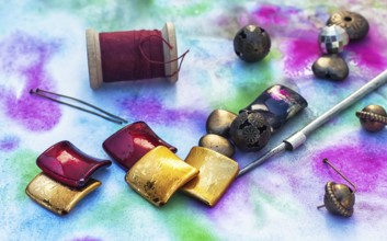 Beads, thread, wire and tools for needlework in variety of styles
