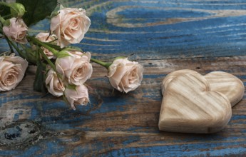 Wooden hearts handmade and roses for the holiday lovers