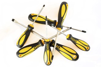 Set of screwdrivers with rubber black and yellow handles isolated on a white background