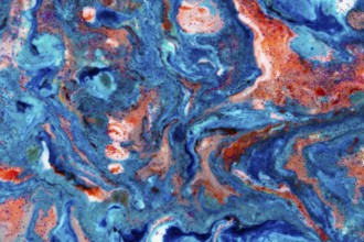 The background is acrylic blue with red lines and sparkles. Colourful marble texture. Liquid, fluid