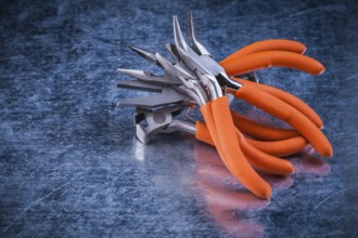 Composition of insulated electric gripping tongs nippers top view image