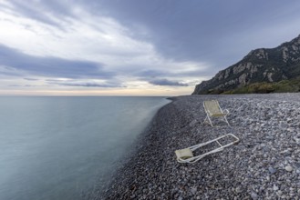 Lonely, deserted, deserted beach with two abandoned deckchairs, long exposure, Coccorocci,