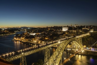 Illuminated Porto City, Douro River and Dom Luis bridge I at Night. View from Tourist Viewpoint