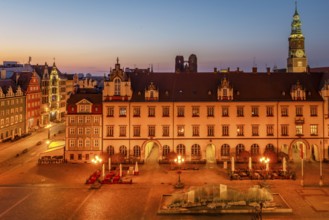 Illuminated architecture and Glass fountain on Market square in Wroclaw, Poland, Europe