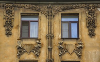 Fragment of the facade with a balcony of an Art Nouveau-style residential building in the city