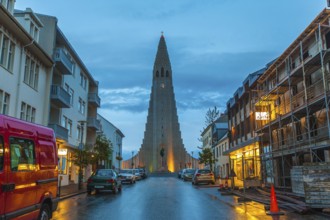 REYKJAVIK, ICELAND, JULY 06::View down a street of illuminated buildings of Hallgrimskirkja church,