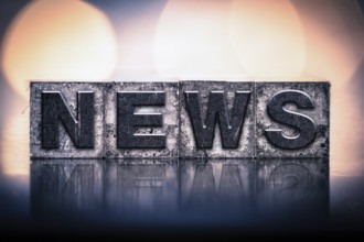 The word NEWS written in vintage ink stained letterpress type
