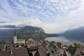 The most picturesque small town in Austria - Hallstatt. Slender bell tower and the church on the