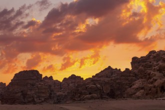 Sunset colorful orange sky landscape with sandstone rocks in Little Petra archaeological site,