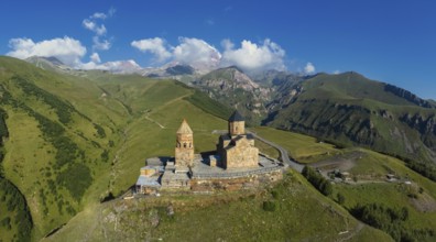 Panorama of Gergeti Trinity Church, Stepantsminda (Kazbegi), Georgia, Caucasus mountains, Asia