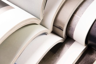 Stack of open magazines