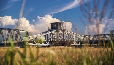 Rusty historic swing bridge with a small driver's cab on the roof