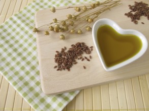 Linseed oil in a heart-shaped porcelain bowl