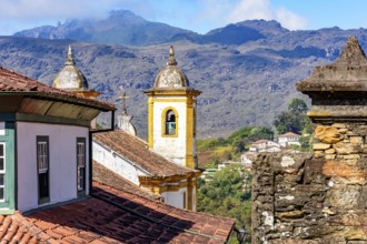 Historical baroque church with mountains in the background in Ouro Preto city in Minas Gerais