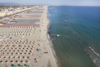 Aerial view of the equipped beach of Lido di Camaiore Tuscany photographed in the late afternoon