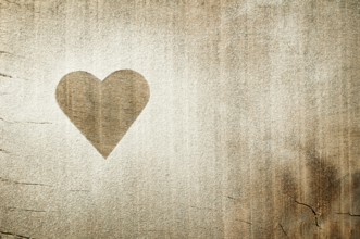 Heart pattern on an old wooden board. Heart made of sugar