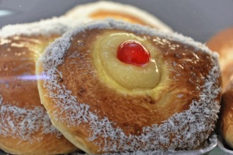 Cadiz, Province of Cadiz, Andalusia, Spain, Europe, Sweet pastry with coconut edge and red cherry