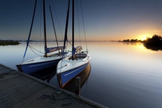 Yacht on lake harbor at sunrise, Leekstermeer, Netherlands
