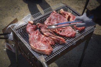 Charcoal-grilled meat image at barbecue. Shooting Location: Tokyo metropolitan area