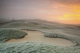 On the empty golf course in winter morning