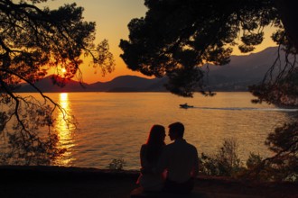 Silhouettes at sunset on the beach in Montenegro