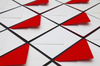 Composition with white and red envelopes on the table. The photo suitable for various holidays and