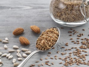Homemade LSA mix in spoon - Linseed or flax seeds, Sunflower seeds and Almonds. Traditional