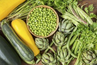 Fresh organic green vegetables wooden floor with copy space. Green and yellow vegetables background