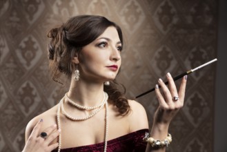 Retro portrait of a woman. Beautiful woman in the style of the 20s or 30s with a mouthpiece