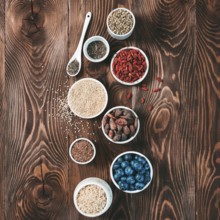 Various superfoods in small bowl on wooden table.Selection super food.Superfood as blueberry, chia,