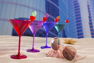 Colorful cocktail in a row with cherry sand in urban city building