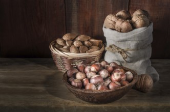 Walnuts on a dark wooden background in a rustic style
