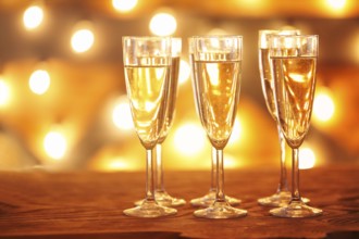 Champagne glasses on golden background. Party and celebration concept
