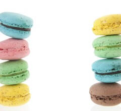 Cadre of stacked colorful macaroons isolated white background