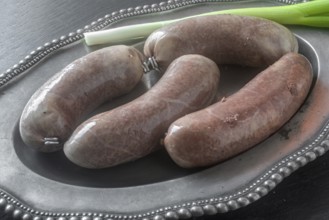 Black pudding on a tin plate