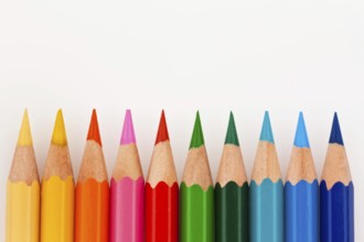 Many different coloured pencils on a white background, Many different colored pencils on white