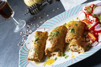 Roast pork vegetable roulade with salads