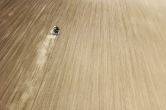 Aerial Tractor sowing crops at field