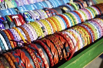 Bracelets of leather in colorful colors hand crafted in an outdoor market