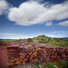 Masonry stonewall in spring with flowers at Menorca Balearic islands